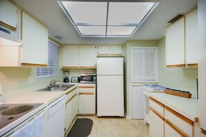 Bright kitchen in this vacation rental in New Smyrna Beach FL with modern amenities.