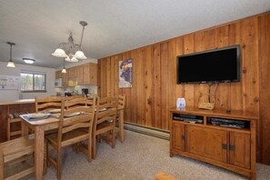 SWP Beaver Village 711 dining area and living room TV