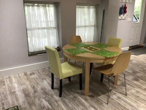 Dining area in open concept kitchen & living area. 