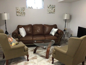 High quality, comfortable leather couch in the living room area, for relaxing