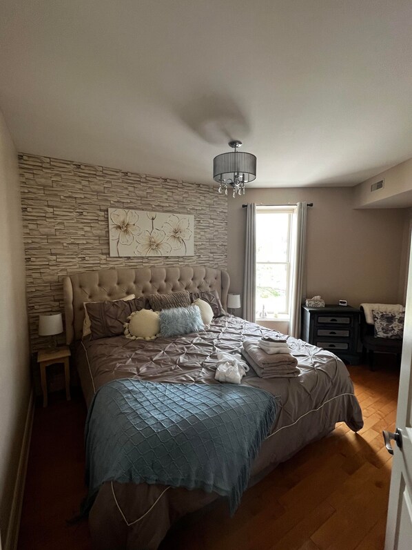 Master bedroom with comfy King Sized bed and ensuite bath.