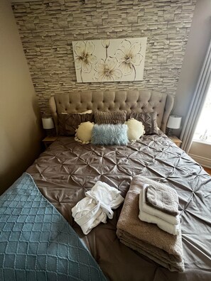 Master bedroom with comfy King Sized bed and ensuite bath.