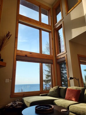 A full wall of windows offer beautiful sun and moonrises over the lake