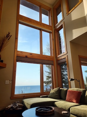A full wall of windows offer beautiful sun and moonrises over the lake