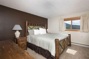 Master bedroom with king bed and private bathroom.