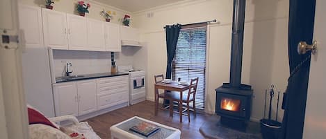 Self-contained cottage with wood fireplace.