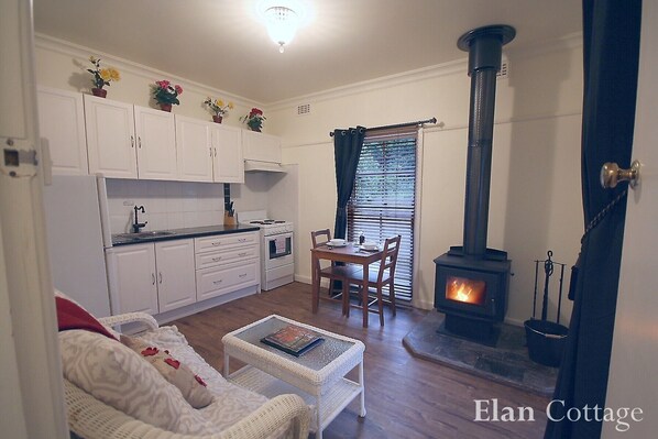 Self-contained cottage with wood fireplace.