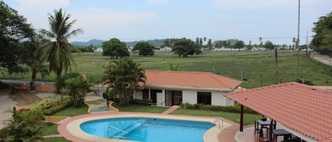 Your view from the balcony! Swim in the pool or walk 5 min to the beach.