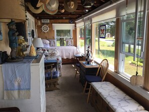 Glassed in porch with day bed