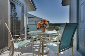 Enjoy the sunny weather from the private patio at this 3 bedroom condo New Smyrna Beach