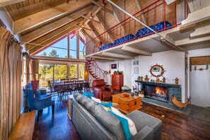 Wood burning fireplace on this level makes things cozy! Nice hardwood floors!