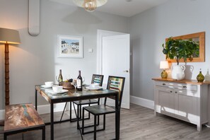 Ground floor: Dining room with table and chairs seating four guests