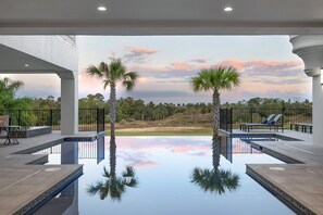 Incredible sunset over the infinity edge pool and sun shelf