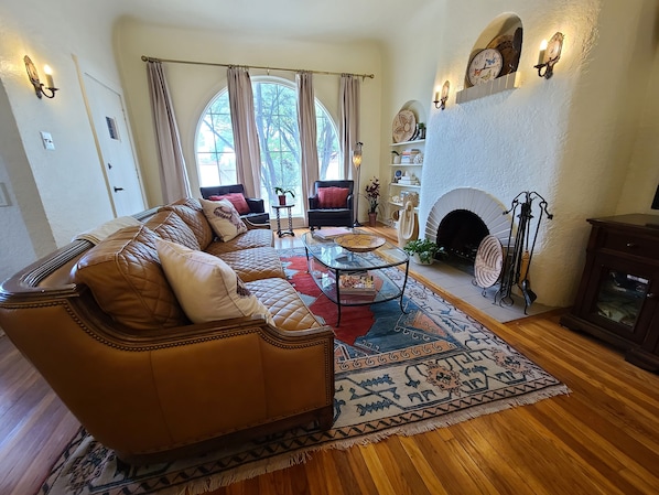 Grand windows let natural light in the inviting and warm living area