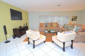 Spacious (Bright) Open Living Area Offers Two Full Size Sofas + Two Chairs + 60 Inch LED High Def TV...