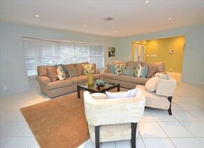 Spacious (Bright) Open Living Area Offers Two Full Size Sofas + Two Chairs + 60 Inch LED High Def TV...