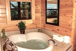 Indulge in relaxation with a soothing soak in the luxurious jacuzzi tub in the master bathroom.