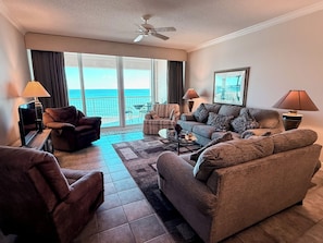 Living room opens to the ocean-front balcony.