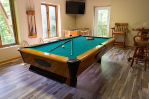 Game Room With Foosball and Table Tennis/ Pool Table. 