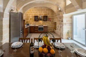 Kitchen and dining room overlooking pool area