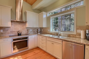 Spacious main floor kitchen with 36" induction cooktop and convection oven.