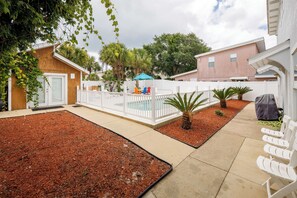 Fenced backyard with gated pool deck