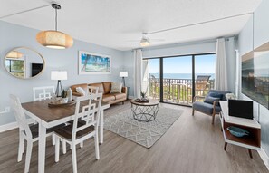 Inviting dining and living space with chic furnishings and warm ambiance.