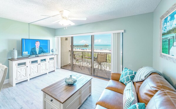 Relax in this bright and cozy living room with stunning outdoor views