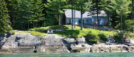 The 'Seaside Sanctuary' perched on granite coastline nestled in the trees