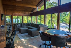 All season porch with game table (poker or bumper pool) and pass thru bar