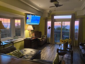 Side windows of this end unit show a wrap around sunset view Bay View Villa 109C