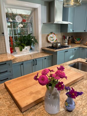 Kitchen is spacious &  fully equipped—fab for group meal prep and casual dining.