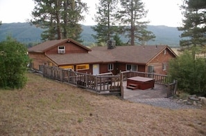 view of the back deck and hot tub