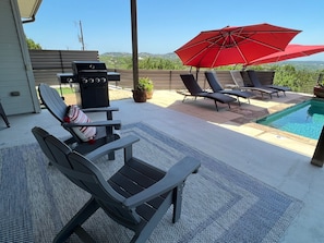 Adirondack chairs are situated to take full advantage of the lake, while shaded.