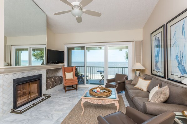 Ocean front living room/14 foot ceilings/marble flooring/herringbone fireplace