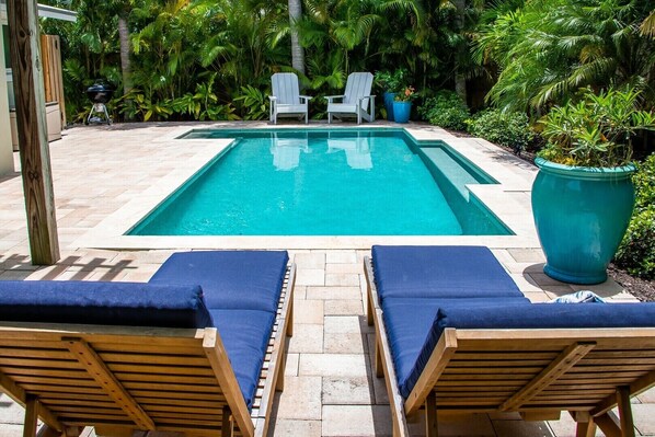 Island Time view to pool behind loungers