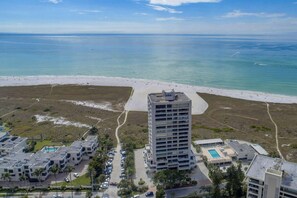 Aerial view of the Terrace building and the private beach on Siesta Key.  Heated community pool off to the right of the building.