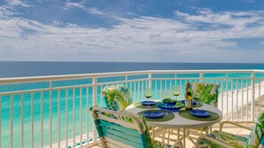 Wrap around Balcony with Table & 6 Chairs + Lounge Chair.