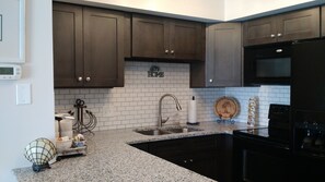 New, modern kitchen with granite counters