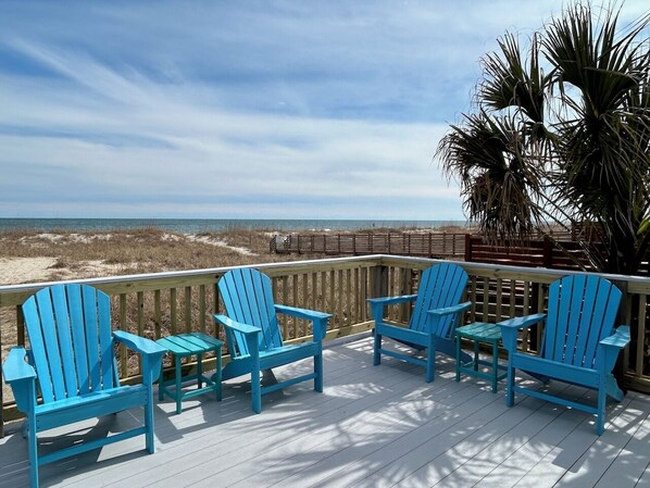 Lots of room to spread out on a large oceanfront deck with swing & picnic table!