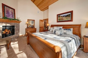 Main level master bedroom with king bed. Private deck with golf course views. Gas fireplace and private bathroom.