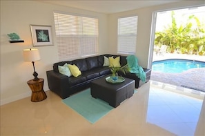 Spacious & Bright Open Living Area w/Leather Sectional Overlooking Outdoor Pool & Lounge Area...