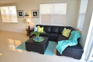 Spacious & Bright Open Living Area w/Leather Sectional Overlooking Outdoor Pool & Lounge Area...