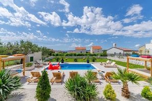 Swimming pool and garden area , view on the pool