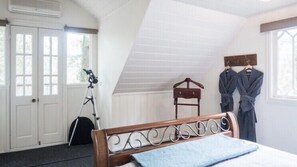 Light and cosy your bedroom overlook the garden and forest