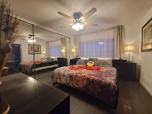 Master bedroom with a king bed 
