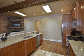 The open kitchen overlooks the living area and offers plenty of space to cook