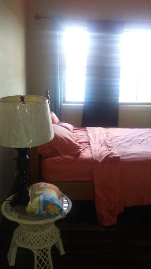 bedroom 3 floor stand fan and overhead