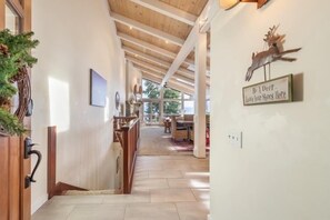 Bright entry onto the top floor with staircase to access two levels of bedrooms.