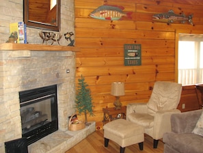 Nice open living room with chair and ottoman  ~